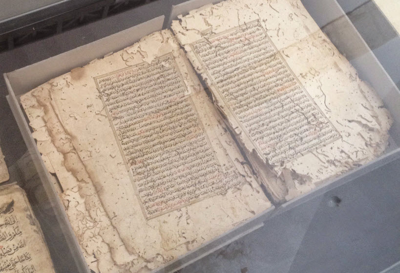 picture of old Qurans being treated